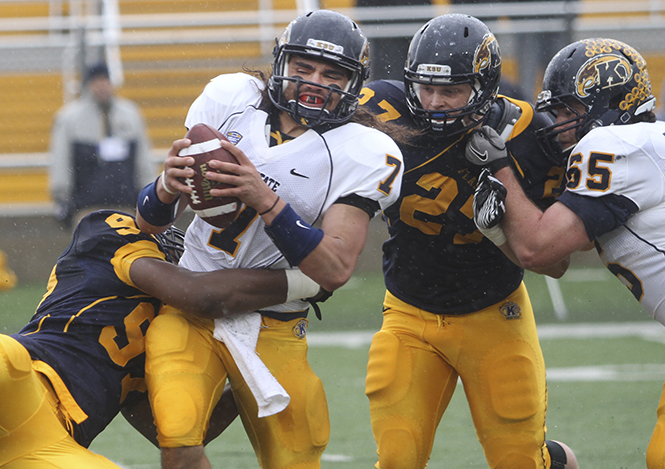 Senior quarterback David Fisher gets sacked during last year's Spring Football Game on April 21, 2012. The Gold Team defeated the Blue Team, 21-0. Photo by Rachel Kilroy.