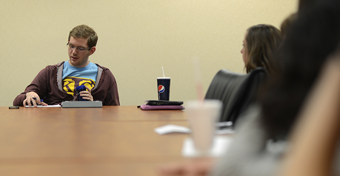 Senior spanish major Tom Ream speaks to fellow members of Kent State organization FACE AIDS during a meeting on the third floor of the student center on Wednesday, April 3. Photo by Jenna Watson.