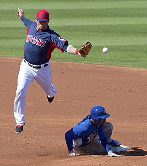 The Kansas City Royals' Jarrod Dyson steals second as the throw to Cleveland Indians shortstop Asdrubal Cabrera bounces off his glove in the third inning of a spring training game at Goodyear Stadium in Goodyear, Arizona, Feb. 26, 2013. The Royals defeated the Indians, 4-1. Photo courtesy of MCT Campus.