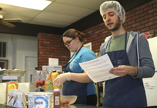 Graduate student Rocco Russo teaches attendees at Kent Social Services about the benefits of antioxidants on Friday, April 12 as part of Kent State's Nutrition Outreach Program. Photo by Shane Flanigan.