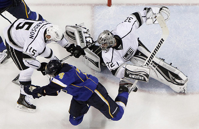 The St. Louis Blues' T.J. Oshie, bottom, tries a backhanded shot against Los Angeles goaltender Jonathan Quick, right, in second-period action in Game 1 of the Western Conference first-round playoff series on Tuesday, April 30, 2013, at the Scottrade Center in St. Louis, Missouri. The Blues won, 2-1, in OT. (Chris Lee/St. Louis Post-Dispatch/MCT)