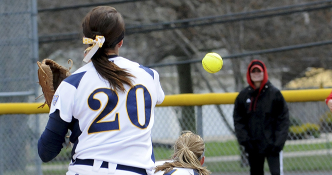 Freshman infielder Michele Duffy throws the ball to first base to get the Northern Illinois runner out on April 19, 2013. The flashes lost 5-1. Photo by Rachael Le Goubin.