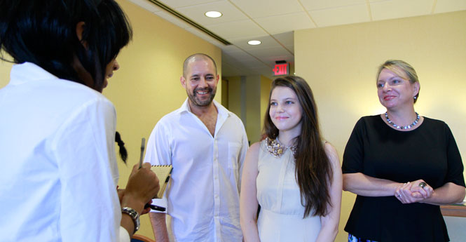 Zoë Burch, Kent State student, receives honors for her quick actions of notifying a potential threat of violence directed at a school in Pennsylvania. Zoë is interviewed by Daily Kent Stater reporter at Kent Student Center. Zoë's parents Michele Burch and Dan Burch also attend the recognition event on Monday, July 22, 2013. Photo by Yolanda Li