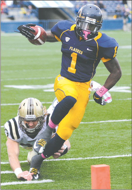 Senior running back Dri Archer defends the ball from a Western Michigan player during the first half of Saturday's Homecoming game on Oct. 20, 2012. The Flashes triumphed 41-21. Photo by Hannah Potes.