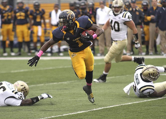 Kent State running back Dri Archer weaves his way through the Western Michigan defense during last year's Homecoming Game in Dix Stadium on Oct. 20, 2012. The Flashes won the game against the Broncos 41-24. Photo by Brian Smith.