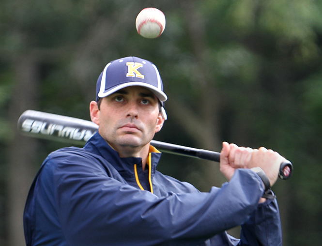 New baseball head coach Jeff Duncan gets ready to hit the ball during a practice drill on Monday, Sept. 23, 2013. Photo by Erin Mclaughlin.