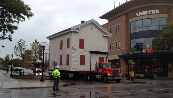 The Wells Sherman house takes a one way trip down East Erie Street Saturday, Sept., 2010.