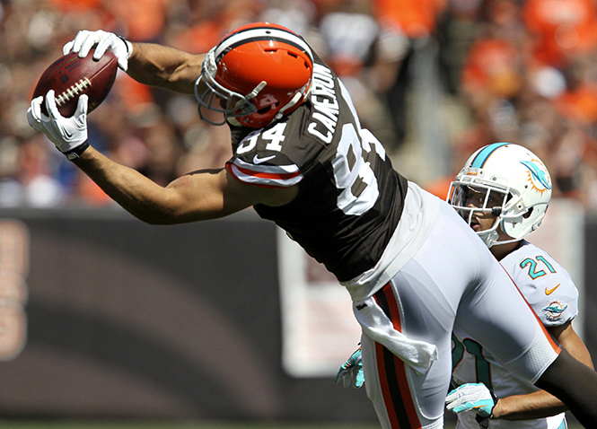 Cleveland Browns tight end Jordan Cameron hauls in a second-quarter pass as Miami Dolphins Brent Grimes covers on the play at FirstEnergy Stadium in Cleveland, Ohio, on Sunday, September 8, 2013. The Dolphins won, 23-10. Photo courtesy of MCT Campus.