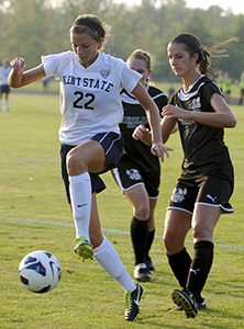 Freshman midfielder Abbie Lawson (left) guards the ball from opponents during the last seconds of Kent State's game against Cleveland State Friday, August 30. Kent State won 1-0. Photo by Hannah Shimko.