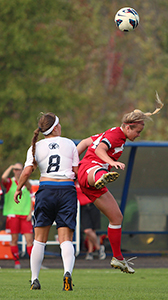 Kent State senior forward Jaclyn Dutton (left) and Youngstown State's Brittany Dowd fight for the ball with a headshot on Friday Sept. 20, 2013. Kent State defeated Youngstown 3-0. Photo by Eslah Attar.