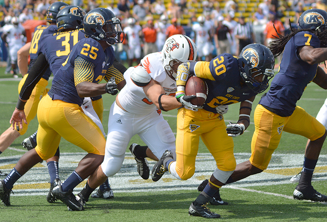 Freshman wide reciever Ernest Calhoun breaks through the line during Kent Sate's game against Bowling Green Saturday, Sept. 7, 2013. Kent State lost 22-41. Photo by Jacob Byk.