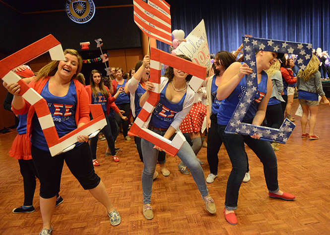 The sisters of Sigma Sigma Sigma show their excitement and await meeting their new members on Sunday Sept. 22, 2013. Photo by Matt Unger.