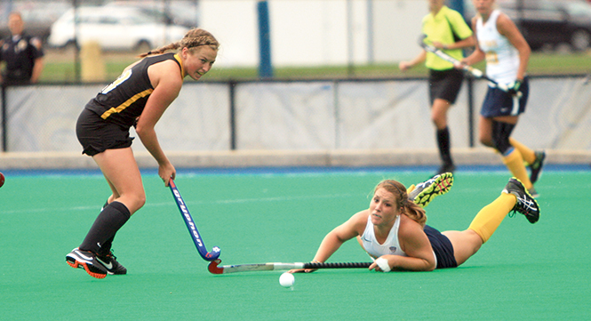 Kent State Junior Abbie Carrico attempted to dive and steal the ball against the University of Iowa on Sunday Sept. 22, 2013. Photo by Emily Lambillotte.