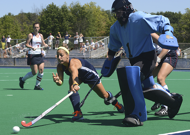 Kent State sophomore Alexis Madeira (left) races Robert Morrison University's goalie Erin McKenzie (right) to the ball during an exhibition game Friday, August 23, 2013. Photo by Melanie Nesteruk.