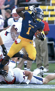 Dri Archer is caught by the Liberty defense during the game at Dix Stadium on Thursday, Aug. 29. Kent State won 17-10. Photo by Brian Smith.