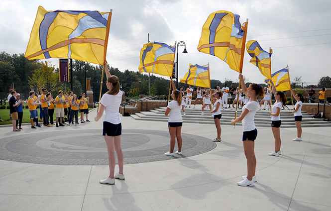 Kent State's color guard performs at a Homecoming pep rally and spirit walk on Thursday, Oct. 3, 2013. The pep rally featured the 2013 Homecoming court as well as players from the football, volleyball and field hockey teams. Photo by Rachael Le Goubin.