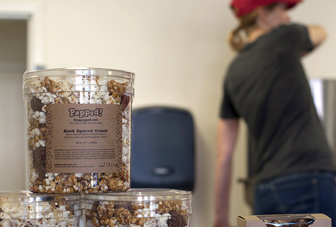 Gwen Rosenberg, owner of Popped!, prepares a batch of caramel popcorn with butter and sea salt on Oct. 8, 2013. Photo by Brianna Neal.