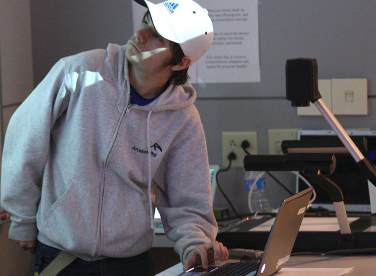 Computer science majors and electronic enthusiasts from all over Ohio met at Kent State last spring for a 36-hour-hackathon, seen here reviewing their research from the weekend on March 10th, 2013. Photo by Emily Lambillottee.