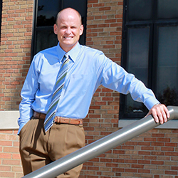 Joel Nielsen, Kent State's Athletic director, sits outside the MAC Center. Nielsen got a contract extension and a raise after being at KSU for three years. Photo by Kristi R. Garabrandt.