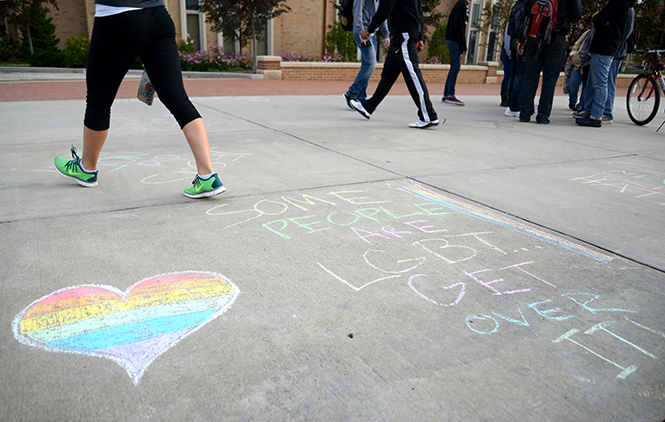 Chalk messages covered Risman Plaza as a protest to a demonstration outside University Library condemning homosexuality and abortion on Tuesday, Oct. 29, 2013. The chalkings were a combination of facts about abortion and the LGBT community, as well as rebuttles to the demonstration's messages. Photo by Jenna Watson.