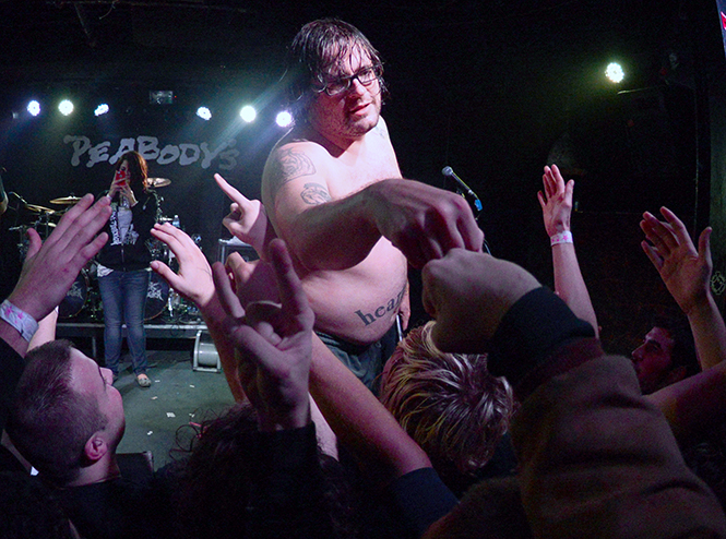 The Black Dahlia Murder lead singer Trevor Strnad greets fans after their show at Peabody's concert club late Thursday, Oct. 24, 2013, one of the last shows the club will host. During the performance, Strnad thanked the concert club and audience for many years of shows at the venue and expressed his sadness in the club's closing. Photo by Jenna Watson.