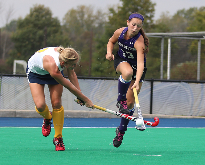 Senior Sabrina Binder defends against an attempted goal during the Flashes' game against Northwestern University on Sunday Oct. 6, 2013. The Flashes lost 3-1. Photo by Coty Giannelli.