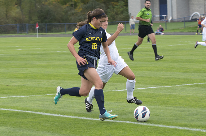 Junior Calli Rinicella sprints down the field going for the goal during a game against the University of Akron on Sunday Oct. 13; 2013. The Flashes won 2-0 over the Zips. Photo by Abby Schafer