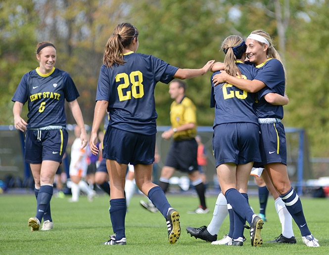 Kent State celebrates as Jessacca Gironda (far right) scores her second of three total goals against Bowling Green State University on Saturday, Sept. 29, 2013, leading the Flashes to a winning score of 5-1. Photo by Jenna Watson.