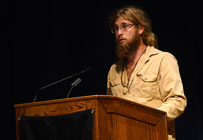 First place winner of the undergraduate poetry scholarship, Thomas Freeman, reads one of his poems during Wick Poetry Center's Poetry Scholarship reading in the KIVA on Monday Oct. 1, 2013.. Photo by Melanie Nesteruk.