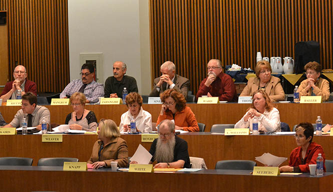 Faculty listen to Provost Todd Diacon speak at the Faculty Senate meeting in the Governance Chambers on Monday, Oct. 7, 2013. Photo by Chloe Hackathorn.