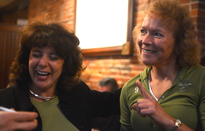 Kent Police Chief Michelle Lee watches the results come in for Issue 4 with Marilyn Session of Kent, inside Ray’s Place on Tuesday November 5, 2013. The issue will help construct a new police station for the department. Photo by Jacob Byk.