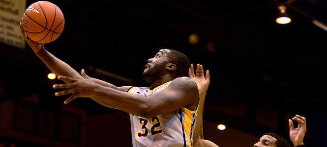 Kent State senior forward Melvin Tabb attempts a layup during Saturdays game on November 23. The game against Niagara completed the Flashes' sweep of the Coaches vs. Cancer Classic. They won the game 102-97. Photo by Melanie Nesteruk.