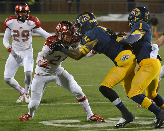 Senior wide receiver Tyshon Goode sets a block for Dri Archer during the game against Miami of Ohio on Wednesday, Nov. 13, 2013 at Dix Stadium. Photo by Jacob Byk.