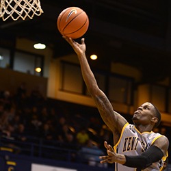 Kent State junior guard Kris Brewer scores in the final game of the Coaches vs. Cancer Classic on Saturday, Nov. 23, 2013. Kent State won the game against Niagara 102-97. Photo by Melanie Nesteruk.