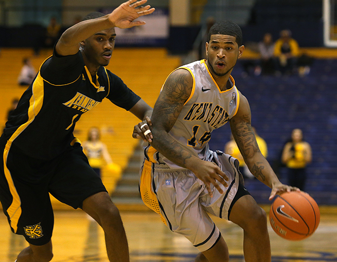 Sophomore guard K.K. Simmons drives the ball toward the basket during the Kent State's game against Kennesaw State Sunday, Dec. 1, 2013. The Flashes won the game 68-51. Photo by Brian Smith.