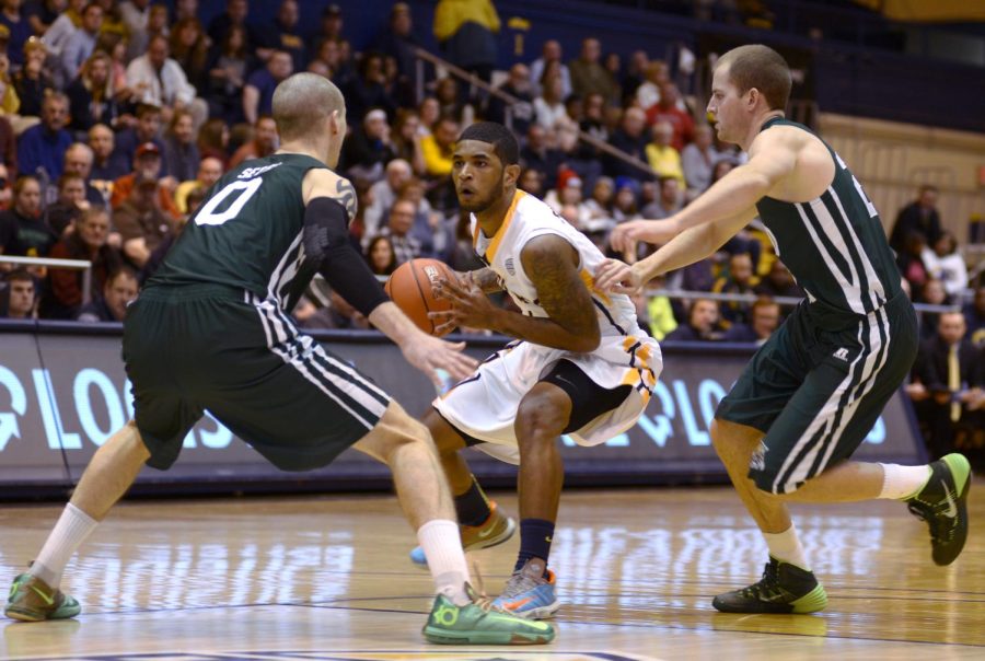 Kent State's Darren Goodson faces two Ohio University defenders during a game Wednesday, Jan. 8, 2013. The Flashes lost to the Bobcats 59-53.