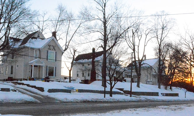 The fraternity houses, such as those that line East Main Street near downtown Kent, will not be forced to relocate to Fraternity Circle.