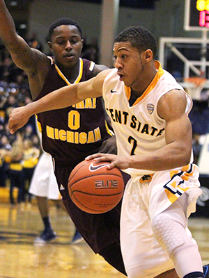 Sophomore guard Kellon Thomas defends the ball from Central Michigan's Braylon Rayson  Saturday, Feb. 15, 2014. The Flashes won the game 83-75.