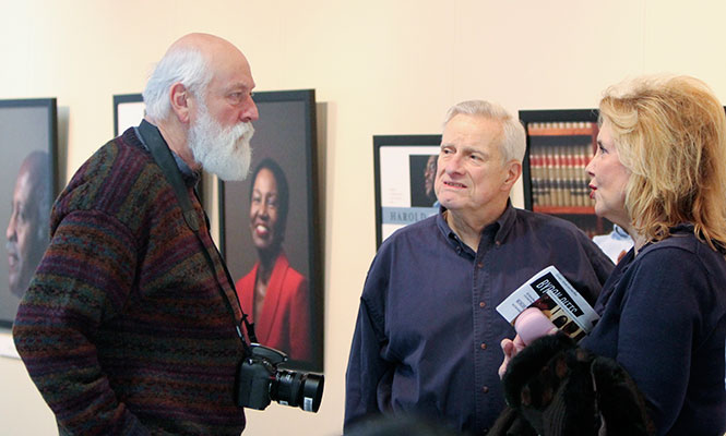 KRISTI R. GARABRANDT | DAILY KENT STATER Kent State Alumni George and Rebecca Zurava speak to JMC professor David LaBelle about Civil Rights at the "They Led the Way" exhibit at First Energy Auditorium in Franklin Hall, Thursday, Feb. 13, 2014.