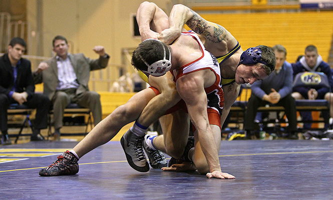 Kent State's Caleb Marsh faces Patrick Jennings at the meet against Edinboro University. The Flashes lost 9-27.