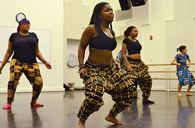 Rumbi Mupinga (center) and fellow members of the Barefeet Dance Tribe practice a traditional African dance, Tuesday, Feb. 11, 2014, in the Music and Speech Center. They practice a series of different dances and songs for two hours, twice a week.