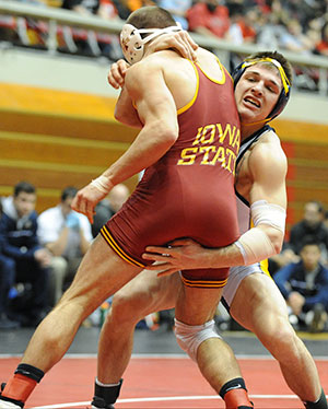 Sophomore Ian Miller battles against Iowa State in the National Duals semifinals, Sunday, Feb. 16, 2014, at St. John's Arena in Columbus, Ohio. Photo by David Dermer/Kent State Athletic Communications.