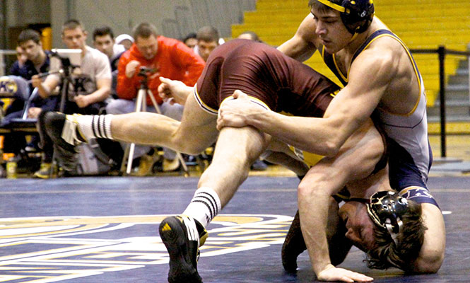 Sophomore Michael Depalma takes on Central Michigan's Scott Mattingly Sunday Jan. 26, 2014. The Flashes lost 12-21.