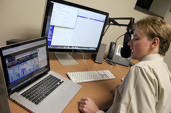 Robert Carroll demonstrates how a TV2 weather cast voiceover is usually recorded, Monday, Feb. 17, 2014, in a Franklin Hall audio lab.