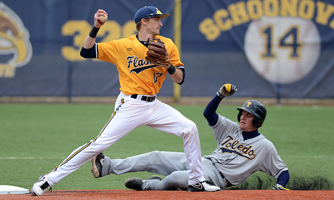 Kent State sophomore infielder Justin Wagler tags out a Toledo opponent at Saturday's game, March 22, 2014, ending in a 6-2 victory for the Flashes.