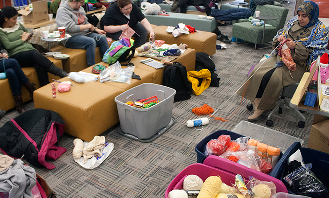 The biannual Knit-a-Thon was hosted by the organization "Knitting for Those in Need" on the fourth floor of the Kent State University  library Friday, Feb.28, 2014. The organization donates hats and scarves to those in need.