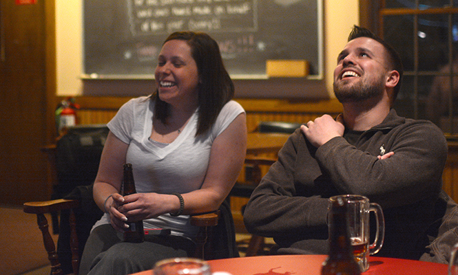 R. Jay Wilkinson, senior marketing major and President of the Kent State Veteran's Club (right) laughs with Catherine Hofer (left), senior nursing major who just returned from active duty on Valentine's Day, at the Kent VFW on Wednesday, Feb. 26, 2014.