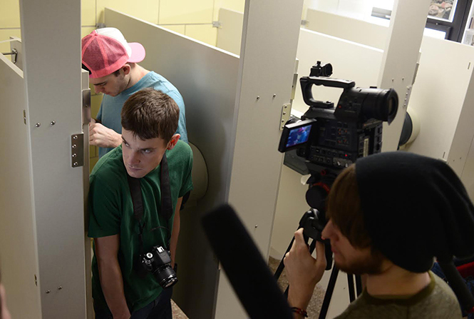 Jesse DiFranco (green shirt) and Jason Kilbane (pink hat) prepare to shoot a scene for the web series "Second Time Around" in Bowman Hall.