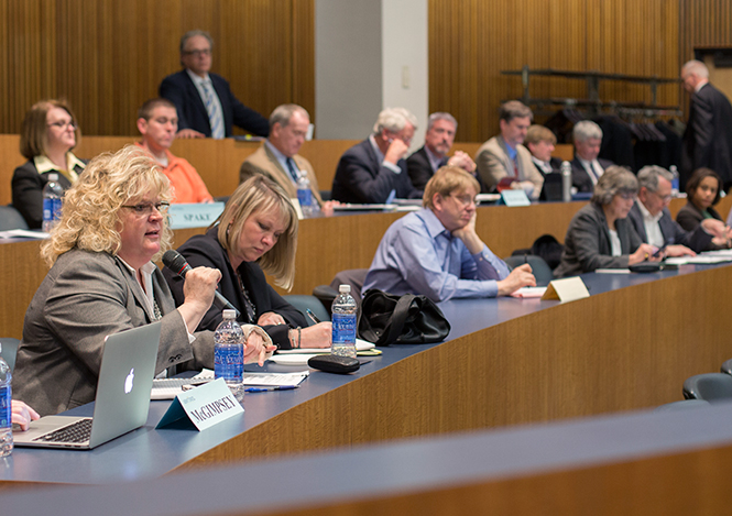 Provost’s Fellow Dr. Melody Tankersley (left) discusses topics with members of the Faculty Senate during the monthly meeting, March 10, 2014, in the governance chambers.