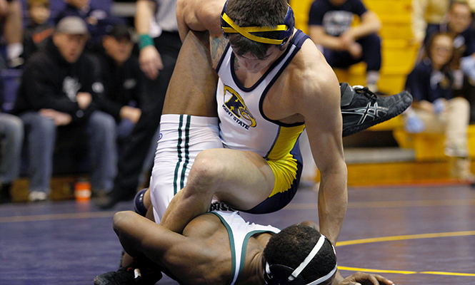 Kent State's Michael DePalma faces his final opponent at his match at the 2014 MAC Championship wrestling meet Sunday, March 8, 2014 in the M.A.C. Center. DePalma's final defeat against an Ohio University player won him third place in his weight class.